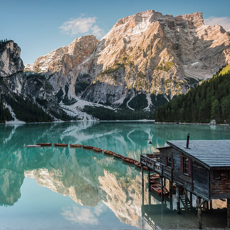Lake Braies with hut & boats in the foreground - Hotel Trenker