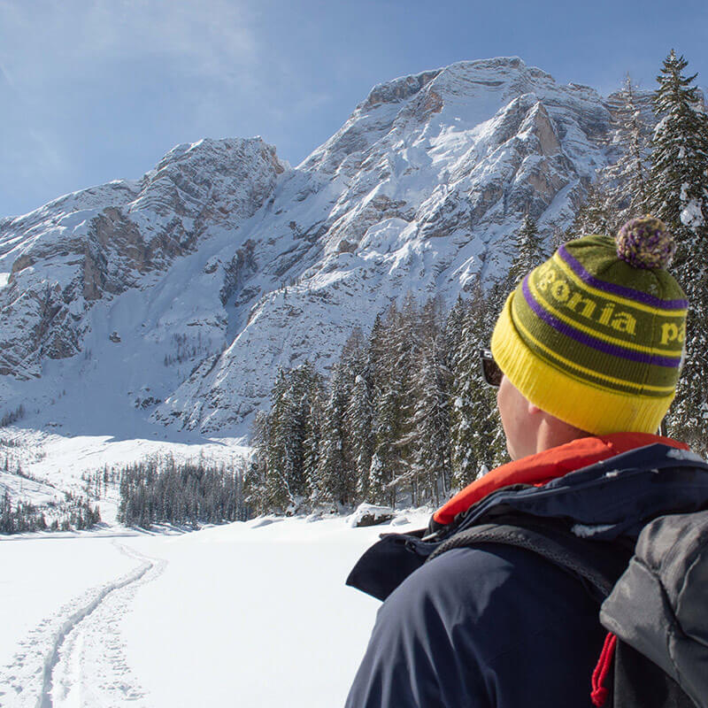 Lake Braies in winter with man - Hotel Trenker